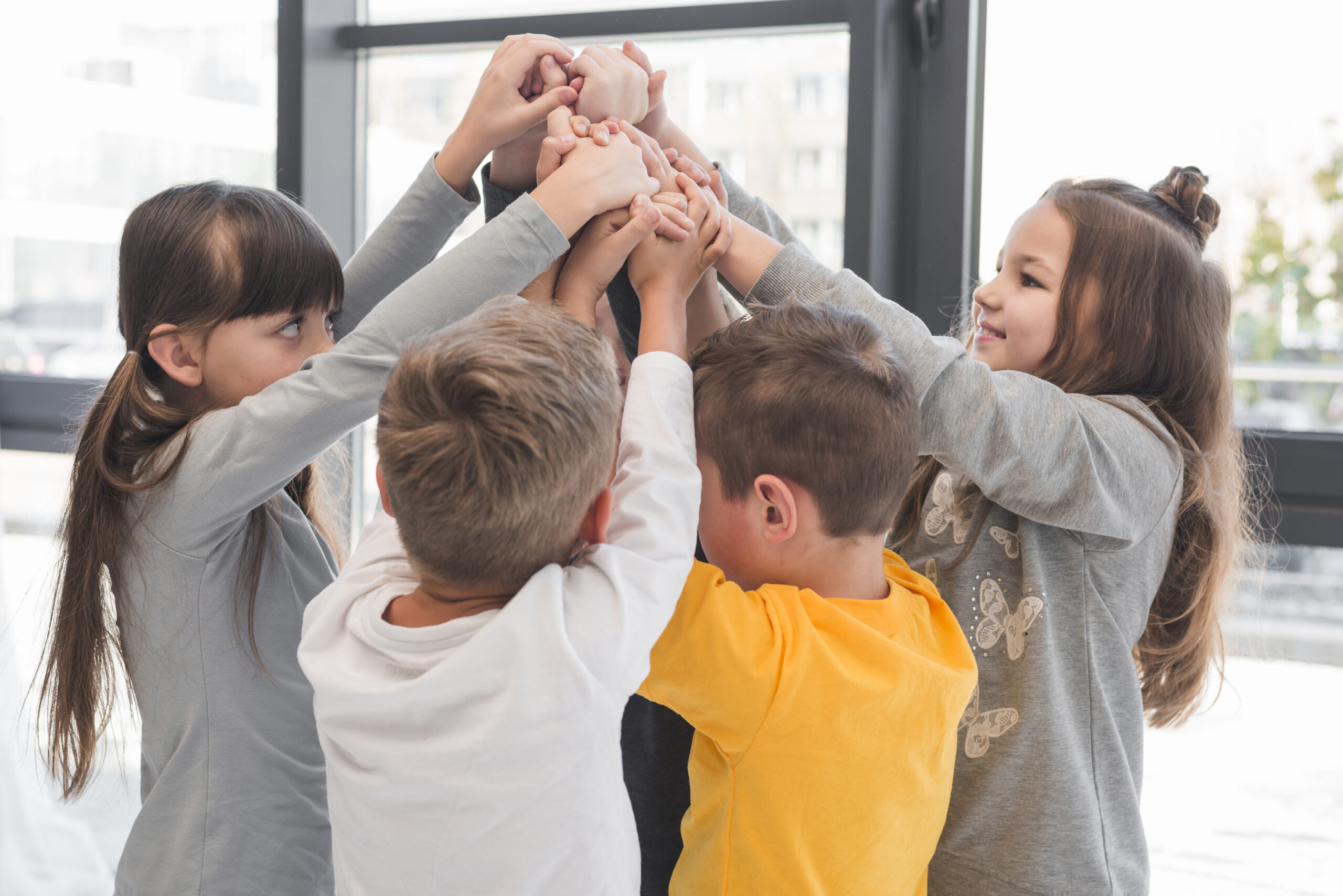 children-with-their-hands-up